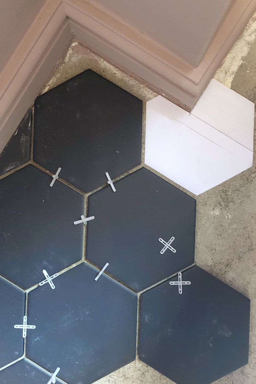 Cloakroom navy hexagon tiles