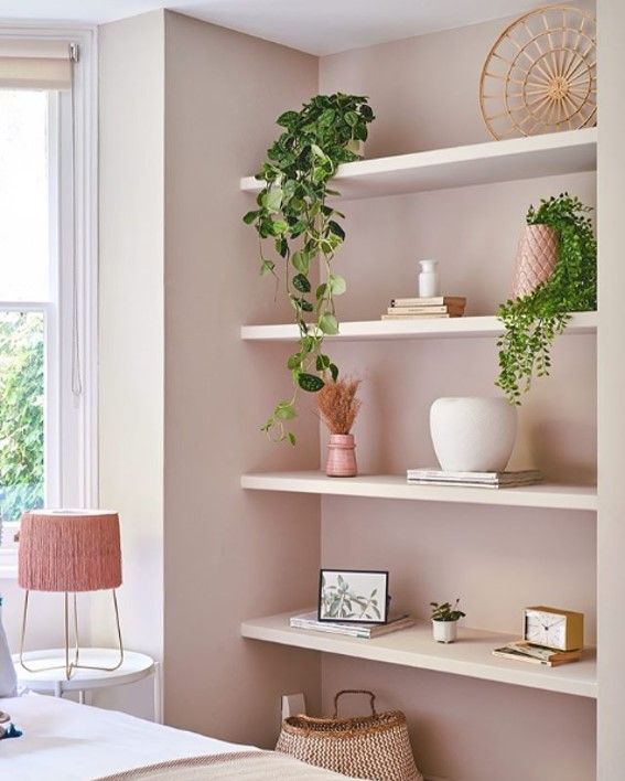 Pastel pink book shelves